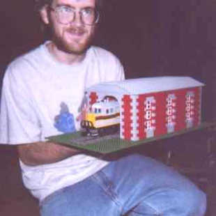 Chris holds up the engine house that he built for his GP-35.