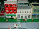 Red, white, green Main Street buildings by Greg Kramer