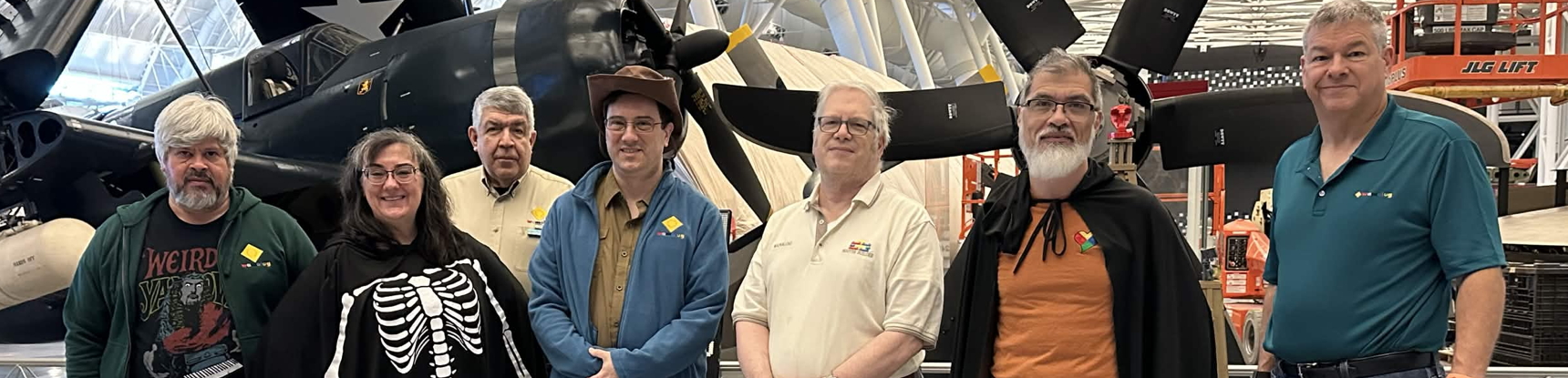 Photograph courtesy Dan Rubin/taken by volunteer with Claude Moore Community Builders. Wamalug participants and aircraft at a museum.